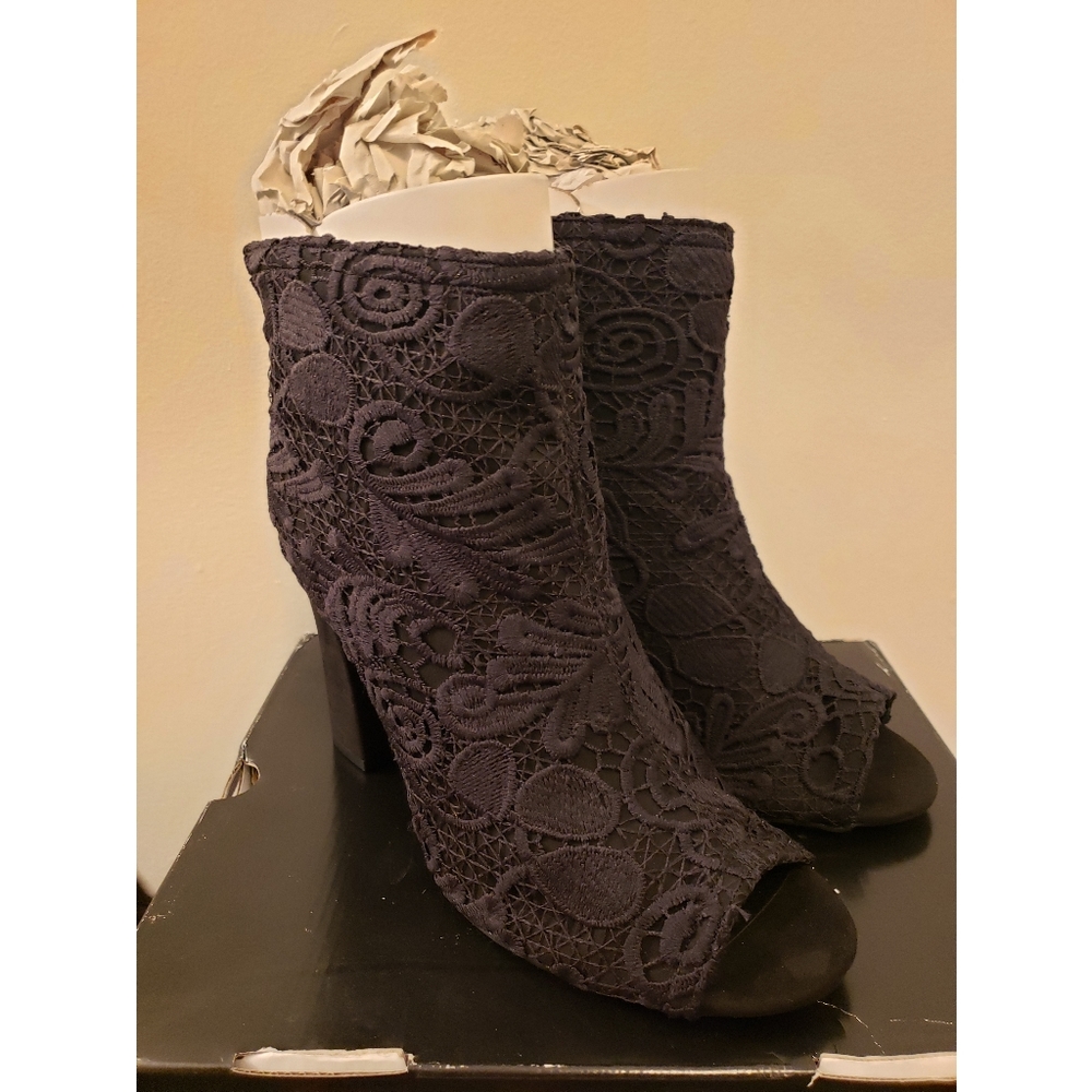 Peep toe lace boots.